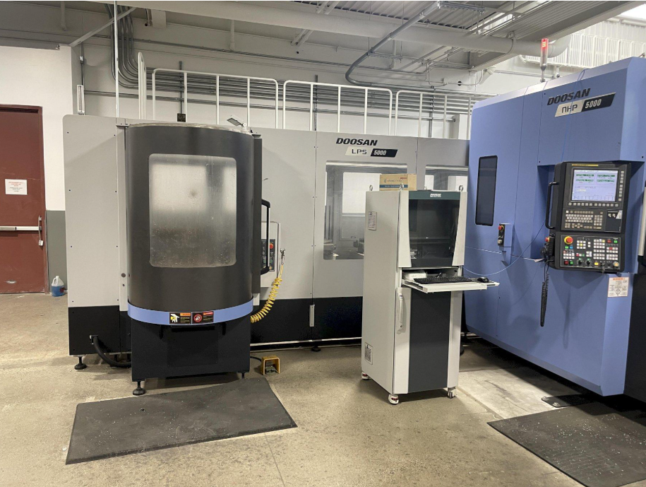 CNC milling center cutting an aluminum block
